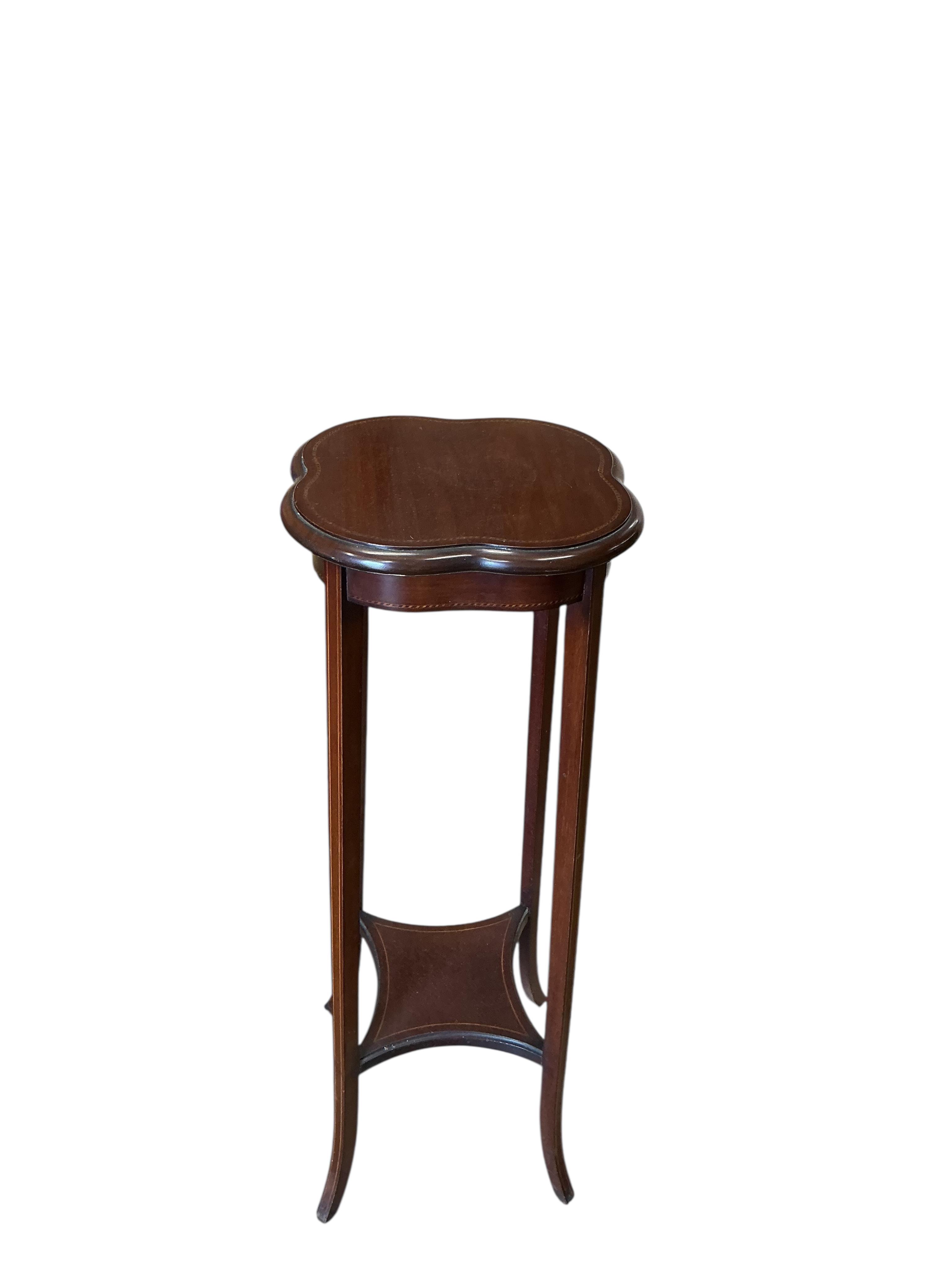 A George III mahogany bow front corner washstand, pot cupboard and an Edwardian plant stand